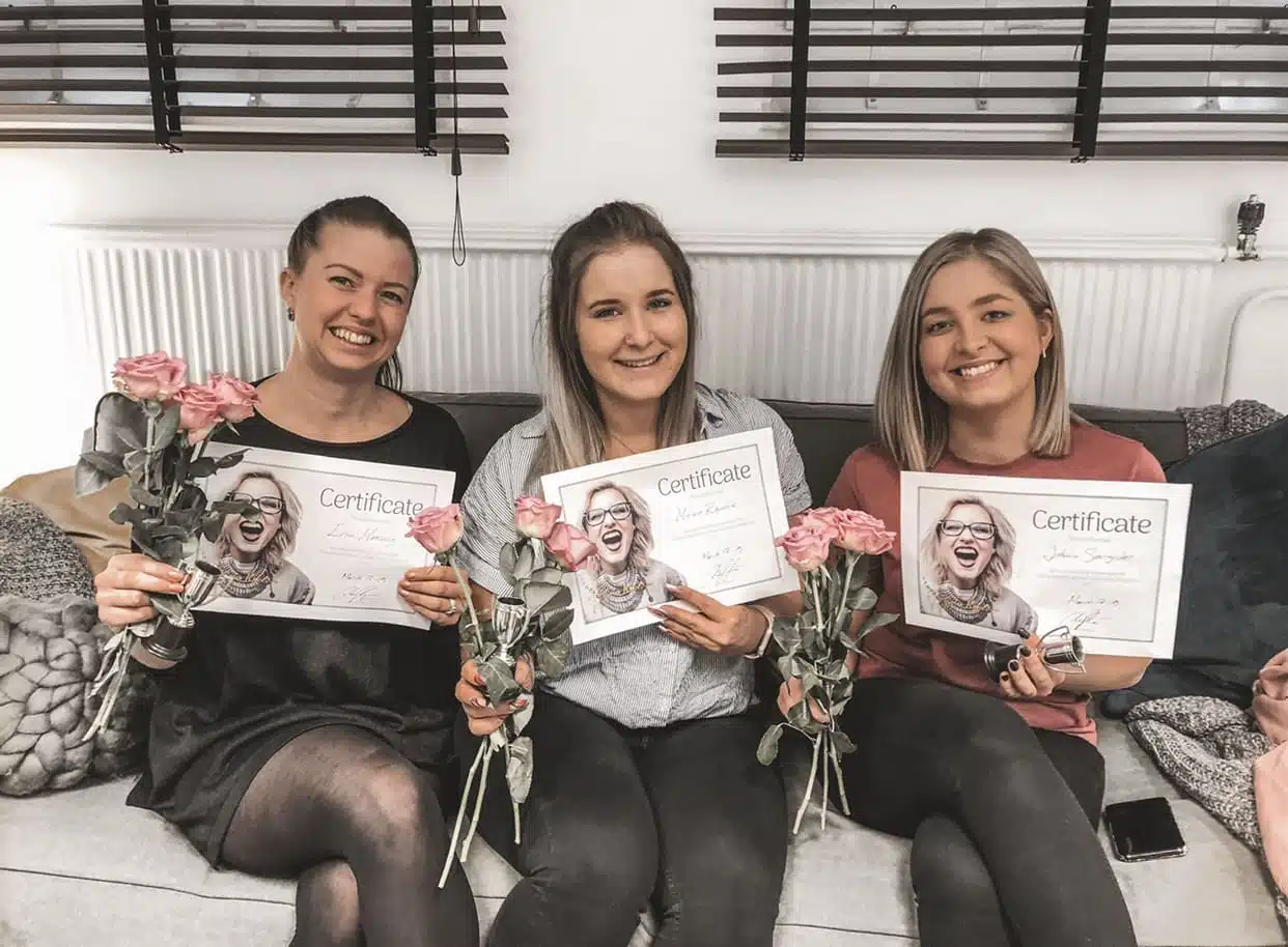 Students holding certificates